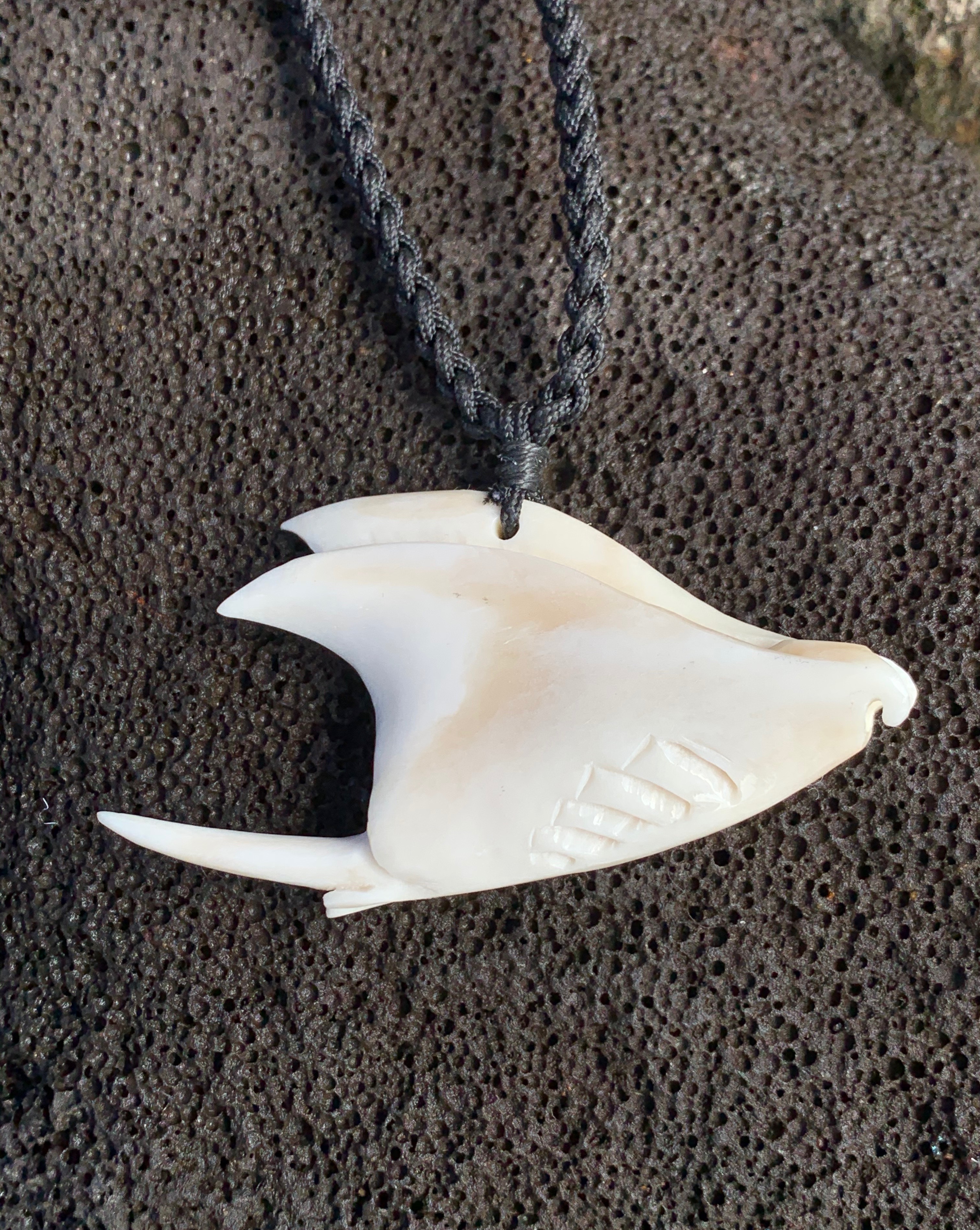 Bone pendant with traditional binding